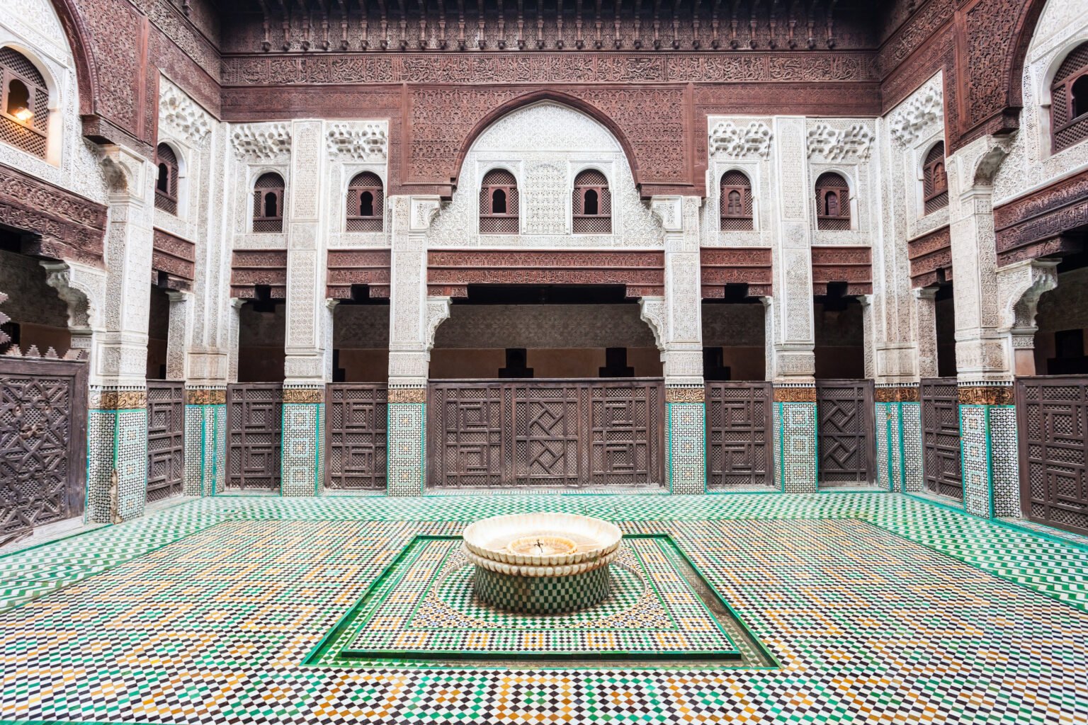 MEKNES, MOROCCO - FEBRUARY 29, 2016: Pattern design element of the Madrasa Bou Inania in Meknes, Morocco. Madrasa Bou Inania is acknowledged as an excellent example of Marinid architecture in Meknes.